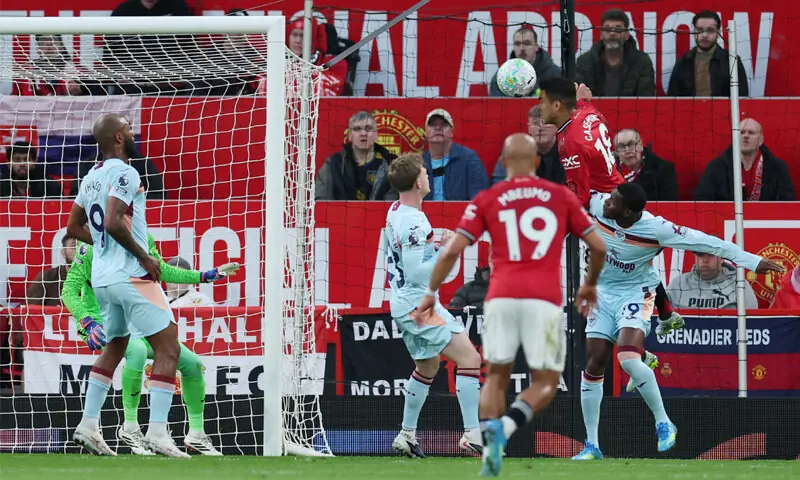MANCHESTER United&rsquo;s Casemiro (top) heads to score against Brentford during their Premier League match at Old Trafford.&mdash;Reuters