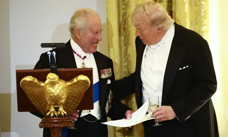 US President Donald Trump and Britain's King Charles III smile as they talk during a State Dinner in the East Room of the White House in Washington, DC, on April 28, 2026. &mdash;AFP