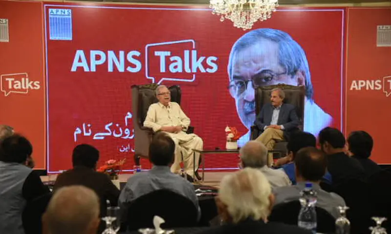 DawnMedia Chief Executive Hameed Haroon speaks, alongside journalist Mazhar Abbas, at the event.&mdash;White Star
