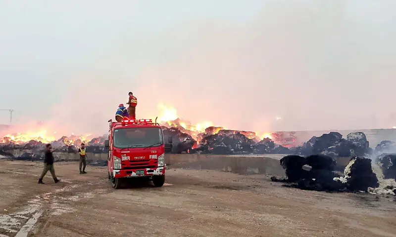 HYDERABAD: A large number of cotton bales are reduced to ashes after a sudden fire broke out in the Excell Textile and Crescent Steel godown in Nooriabad on Wednesday.&mdash;Umair Ali
