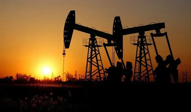 In this file photo, pumpjacks are seen against the setting sun at the Daqing oil field in Heilongjiang province, China on December 7, 2018. &mdash; Reuters/File