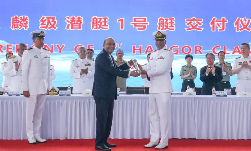 PRESIDENT Zardari and naval chief Admiral Naveed Ashraf (centre-left) attend the ceremony.&mdash;Online