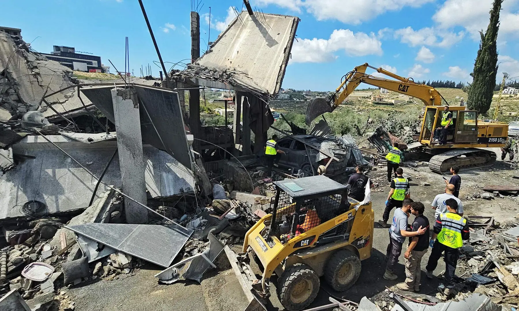 First responders search for survivors amongst the rubble at the site of an Israeli airstrike that targeted the southern Lebanese village of Ain Baal on May 1, 2026. &mdash; AFP