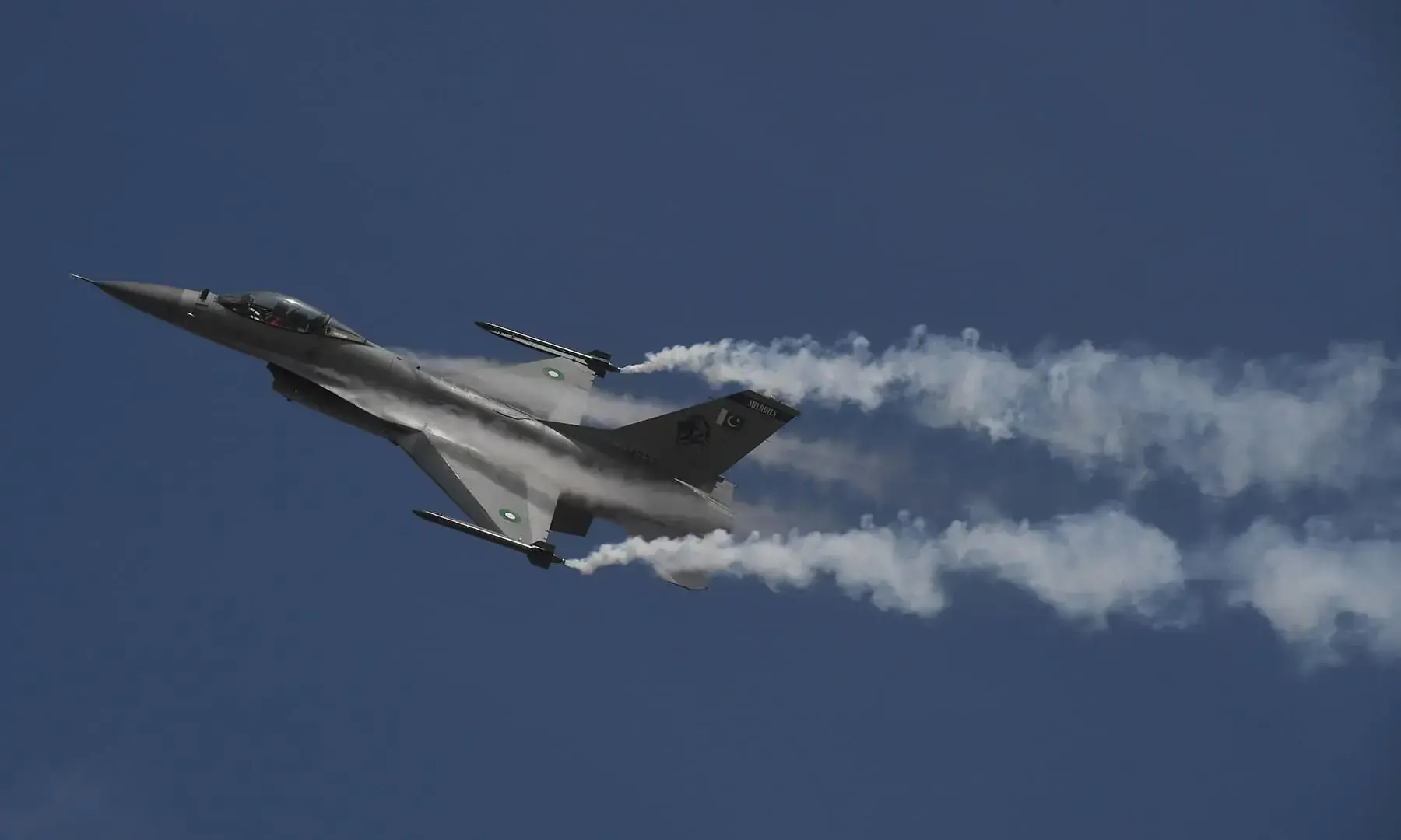A Pakistan Air Force (PAF) F-16 flies over Karachi during a ceremony to commemorate 'Operation Swift Retort'. &mdash; AFP/File