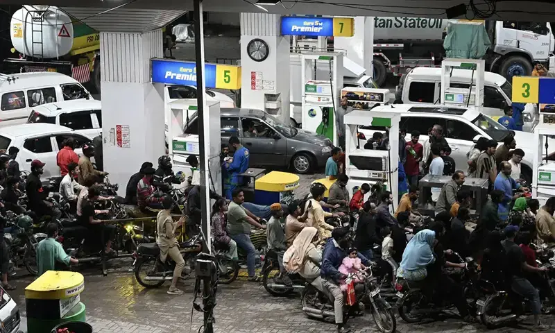 Motor vehicles queue at a petrol station in Karachi on April 3, 2026 amid rising petrol prices: Pakistan has more than 30 million registered motorcycles that consume a quarter of the fossil fuels the country burns | AFP