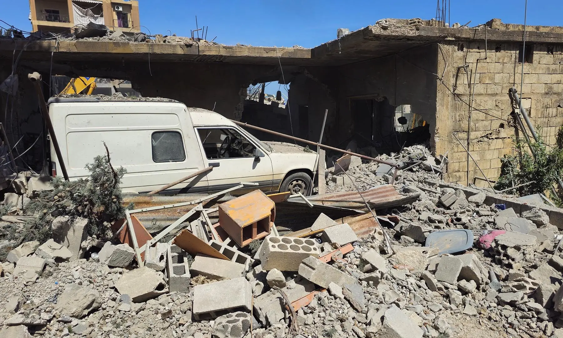 A vehicle remains trapped amid the rubble of a destroyed building following Israeli strikes in the town of Habboush, in southern Lebanon&rsquo;s Nabatieh Governorate on May 2, 2026. &mdash; Reuters