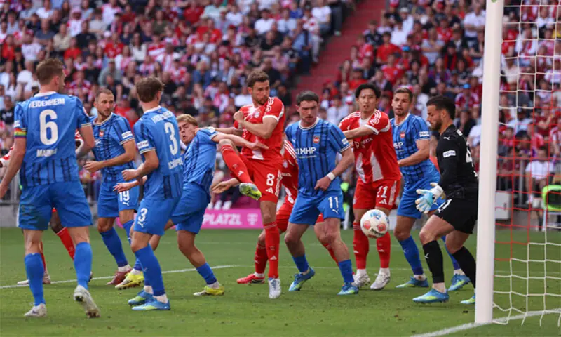 MUNICH: Bayern Munich&rsquo;s Leon Goretzka (C) scores past Heidenheim goalkeeper Diant Ramaj during their Bundesliga match at the Allianz Arena on Saturday.&mdash;AFP