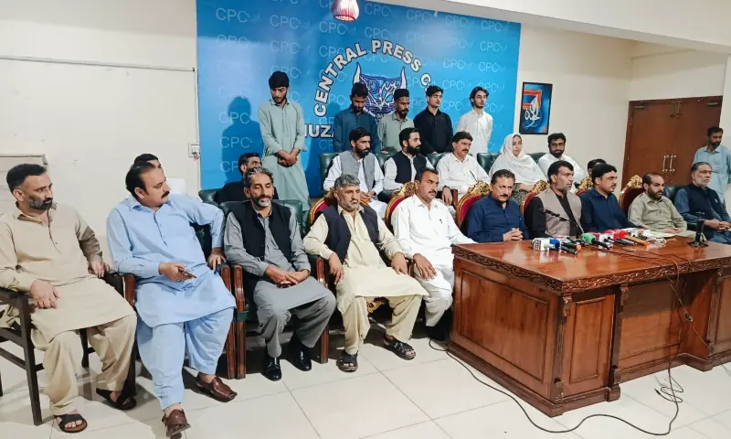 PTI&rsquo;s regional information secretary Azhar Gillani (centre) and other leaders, including six members of district council Muzaffarabad, speak at a press conference in Muzaffarabad on Saturday. &mdash; Photo by author