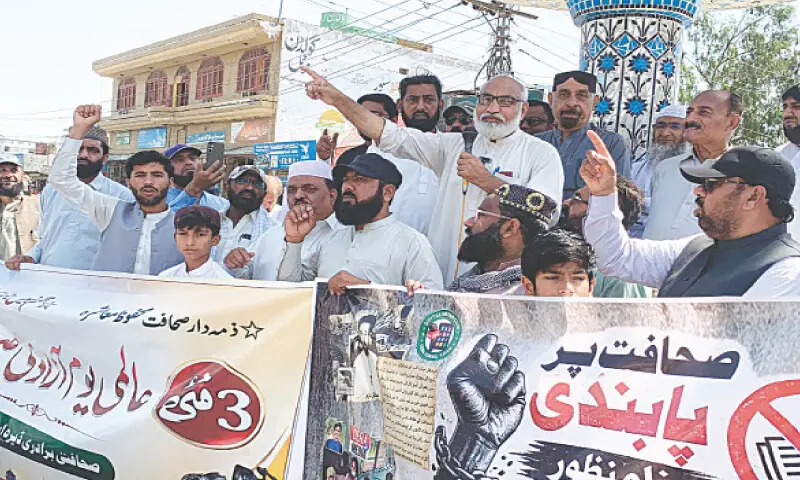 Journalists stage a rally in Dera Ismail Khan on Sunday. &mdash; Dawn