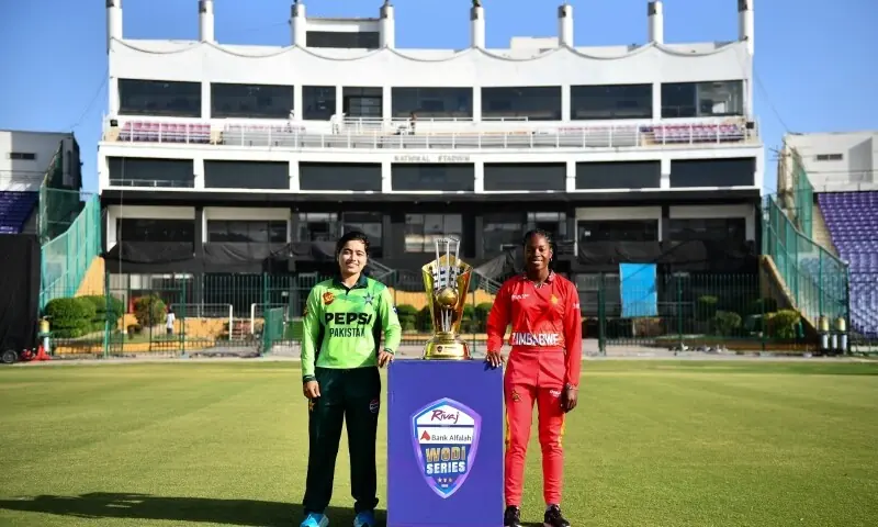 Pakistan captain Fatima Sana and Zimbabwe captain Nomvelo Sibanda pose with the trophy at the National Bank Stadium in Karachi on May 3, 2026. &mdash; Photo courtesy PCB