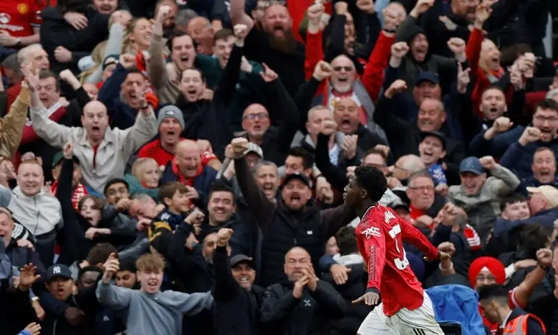 Manchester United's Kobbie Mainoo celebrates scoring their third goal against Liverpool in Old Trafford, Manchester, Britain on May 3, 2026. &mdash;AFP