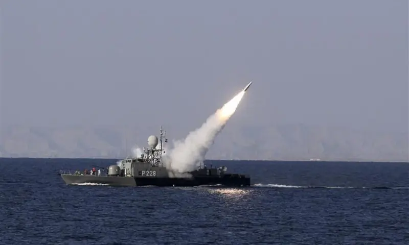 A rocket fires from a military boat during Velayat-90 war game on Sea of Oman near the Strait of Hormuz in southern Iran, December 30, 2011. &mdash;Reuters/File