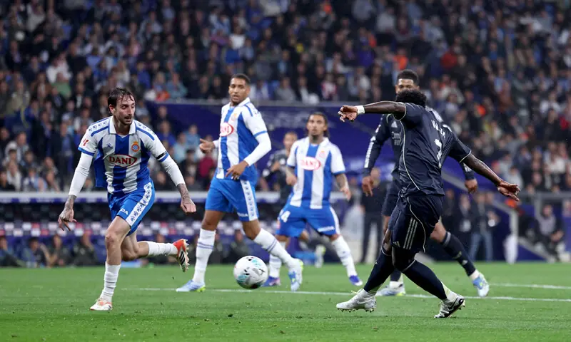REAL Madrid&rsquo;s Vinicius Junior (R) scores against Espanyol during their La Liga match at the RCDE Stadium.&mdash;AFP