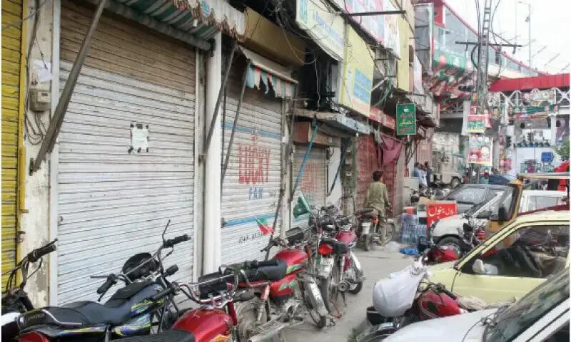 In this file photo from August 2022, shops along Murree Road remain closed due to the PTI&rsquo;s public gathering at Liaquat Bagh in Rawalpindi. &mdash; Dawn/File