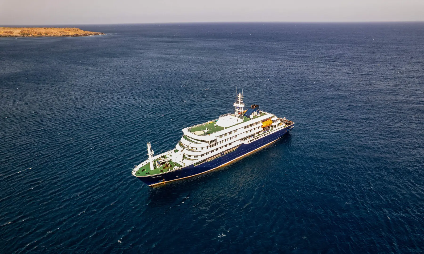 This aerial picture shows a general view of the cruise ship MV Hondius stationary off the port of Praia, the capital of Cape Verde, on May 3, 2026. &mdash; AFP
