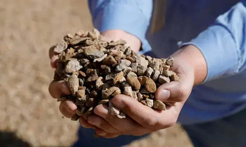 Matt Green, mining/crushing supervisor at MP Materials, displays crushed ore before it is sent to the mill at the MP Materials rare earth mine in Mountain Pass, California, US on Jan 30, 2020. &mdash; Reuters/File