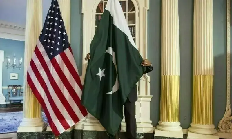 A State Department contractor adjusts a Pakistan national flag in Washington. &mdash; Reuters/File