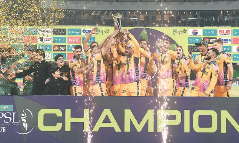 Peshawar Zalmi team hold the Pakistan Super League 2026 trophy after defeating the Hyderabad Kingsmen in the final at Lahore