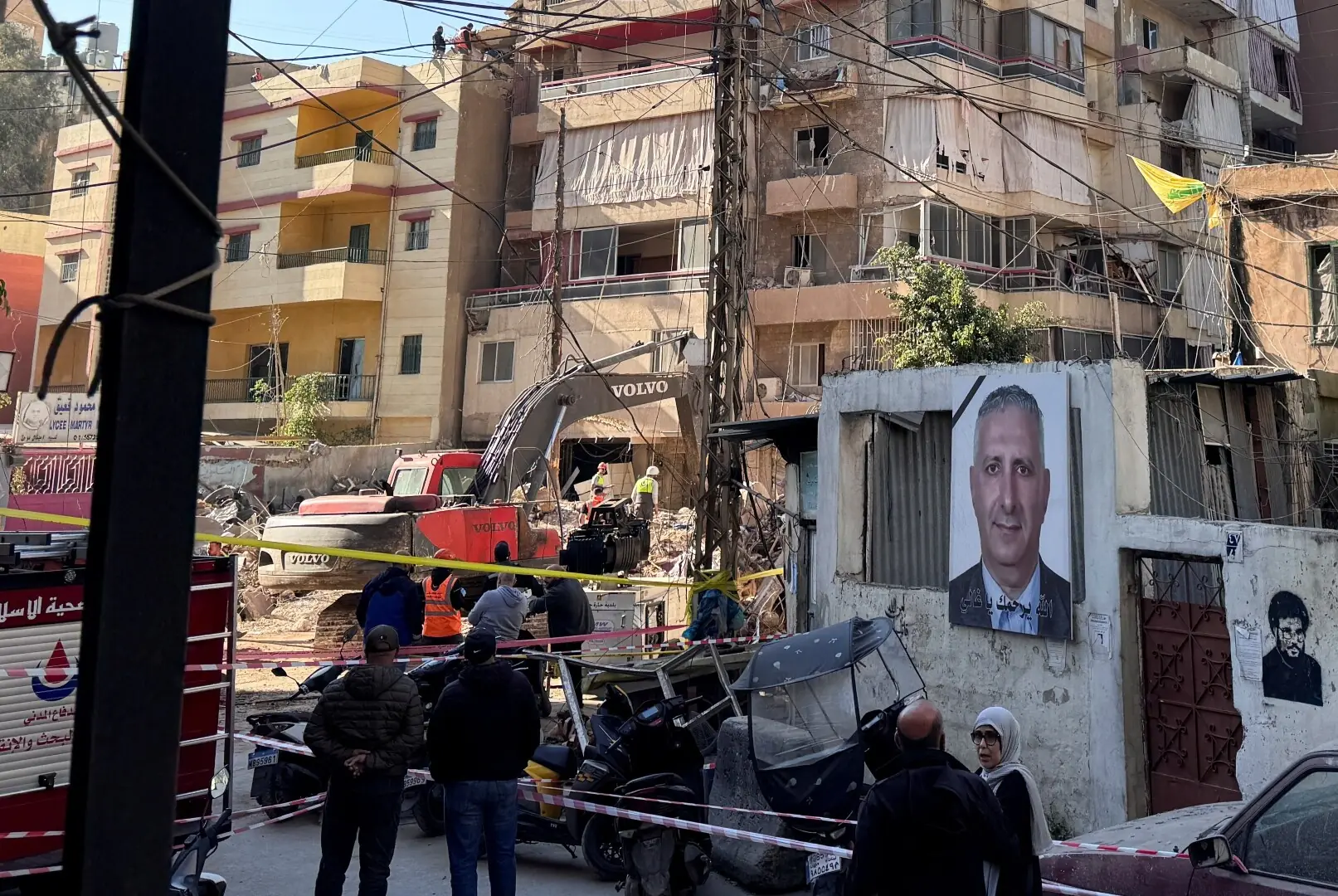 People gather as rescuers work at the site of an Israeli strike that took place yesterday, in the southern suburbs of Beirut, Lebanon on May 7, 2026. &mdash;Reuters