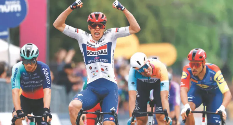 SOUDAL Quick-Step French rider Paul Magnier celebrates as he crosses the finish line to win the first stage of the Giro d’Italia on Friday.—AFP SOUDAL Quick-Step French rider Paul Magnier celebrates as he crosses the finish line to win the first stage of the Giro d’Italia on Friday.—AFP