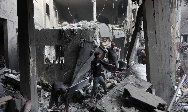 Palestinians inspect the site, a day after of an Israeli strike at the Shati refugee camp (Beach) in Gaza City, on May 9, 2026. &mdash;AFP