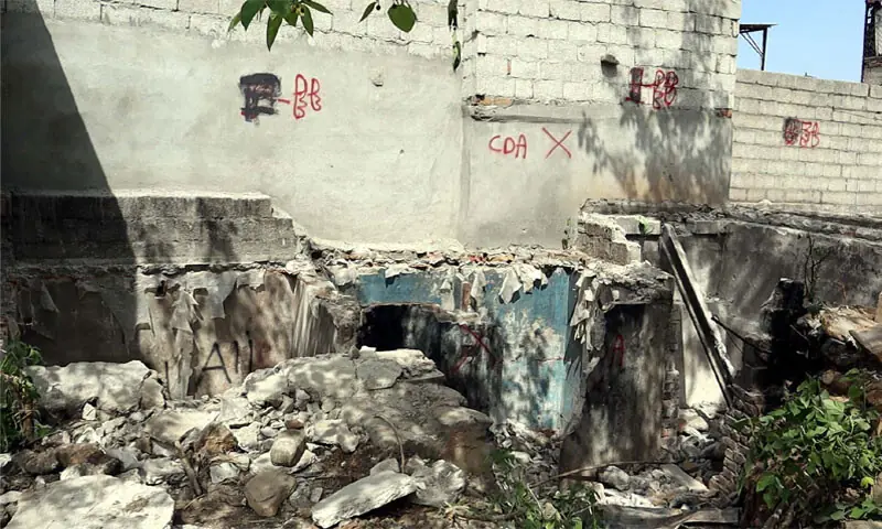 The red X with CDA scribbled alongside it on a wall in Allama Iqbal Colony in Islamabad, marking it for demolition: the neighbourhood houses more than 1,000 Christian families | Photo by the writer