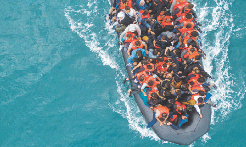 This file photo taken on Aug 6, 2024, shows an inflatable dinghy carrying migrants making its way towards England from France.&mdash;Reuters/File