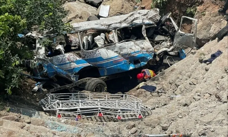 A rescue worker operates on the site of a damaged passenger bus, after it plunged into a deep ravine in Kahuta on August 25, 2024. &mdash; Reuters/File