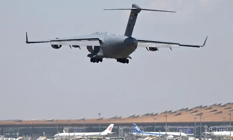 A US Air Force C-17 lands at Beijing Capital Airport in Beijing on May 11, 2026, ahead of a visit by US President Donald Trump. &mdash;AFP