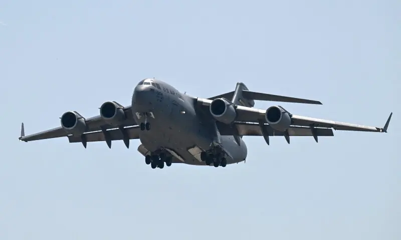 A US Air Force C-17 lands at Beijing Capital Airport in Beijing on May 11, 2026, ahead of a visit by US President Donald Trump. &mdash;AFP