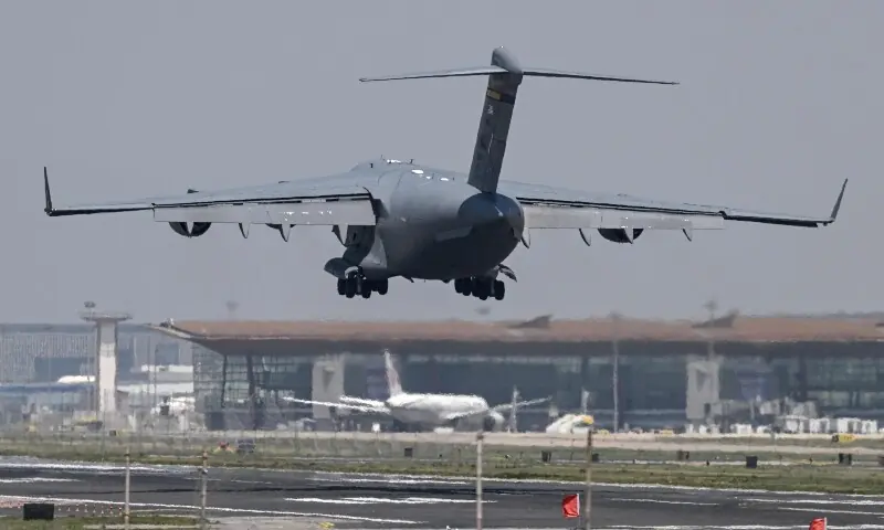 A US Air Force C-17 lands at Beijing Capital Airport in Beijing on May 11, 2026, ahead of a visit by US President Donald Trump. &mdash;AFP