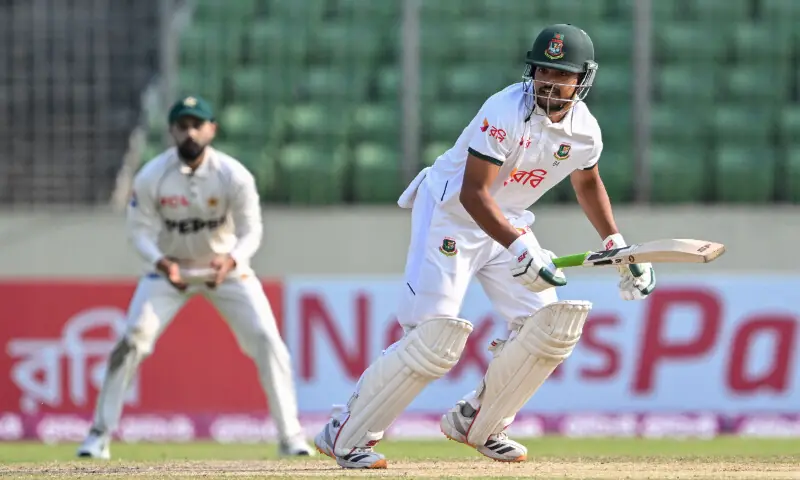 Bangladesh's captain Najmul Hossain Shanto (R) runs after playing a shot during the fourth day of the first Test cricket match between Bangladesh and Pakistan at the Sher-e-Bangla National Stadium in Mirpur on May 11, 2026. &mdash; AFP