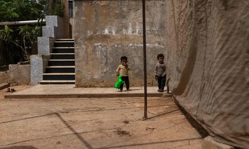 Palestinian Bedouin children play in the Bedouin community of Dar Abu Faza, on the outskirts of the Israeli-occupied West Bank village of Taybeh, on May 12. &mdash; AFP