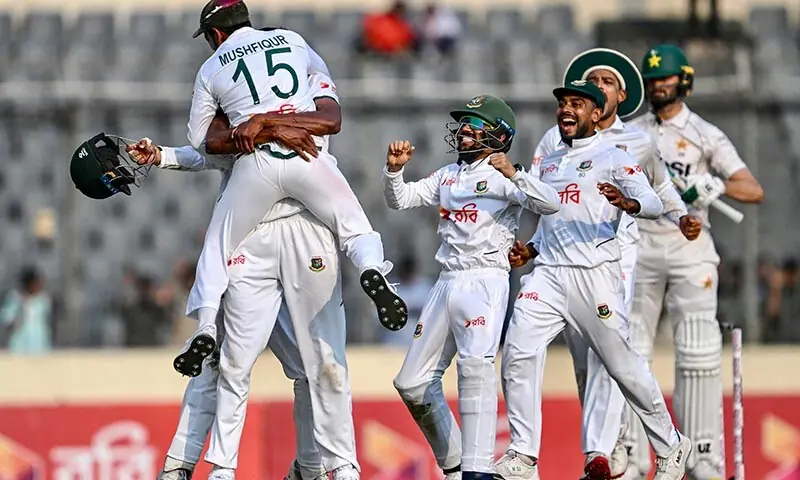 Bangladesh's players celebrate their team's win at the end of the fifth day of the first Test cricket match against Pakistan at the Sher-i-Bangla National Stadium in Mirpur, Bangladesh on May 12, 2026. &mdash; AFP