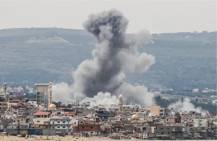 TYRE: Smoke rises from the site of an Israeli airstrike that targeted the area of Ras Al-Ain. Israel has intensified its attacks in south Lebanon despite an April 17 ceasefire that aimed to halt the fighting. &mdash;AFP