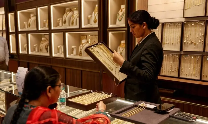 A customer looks at gold chains at a jewellery shop in Varanasi on May 12, 2026. —AFP A customer looks at gold chains at a jewellery shop in Varanasi on May 12, 2026. —AFP