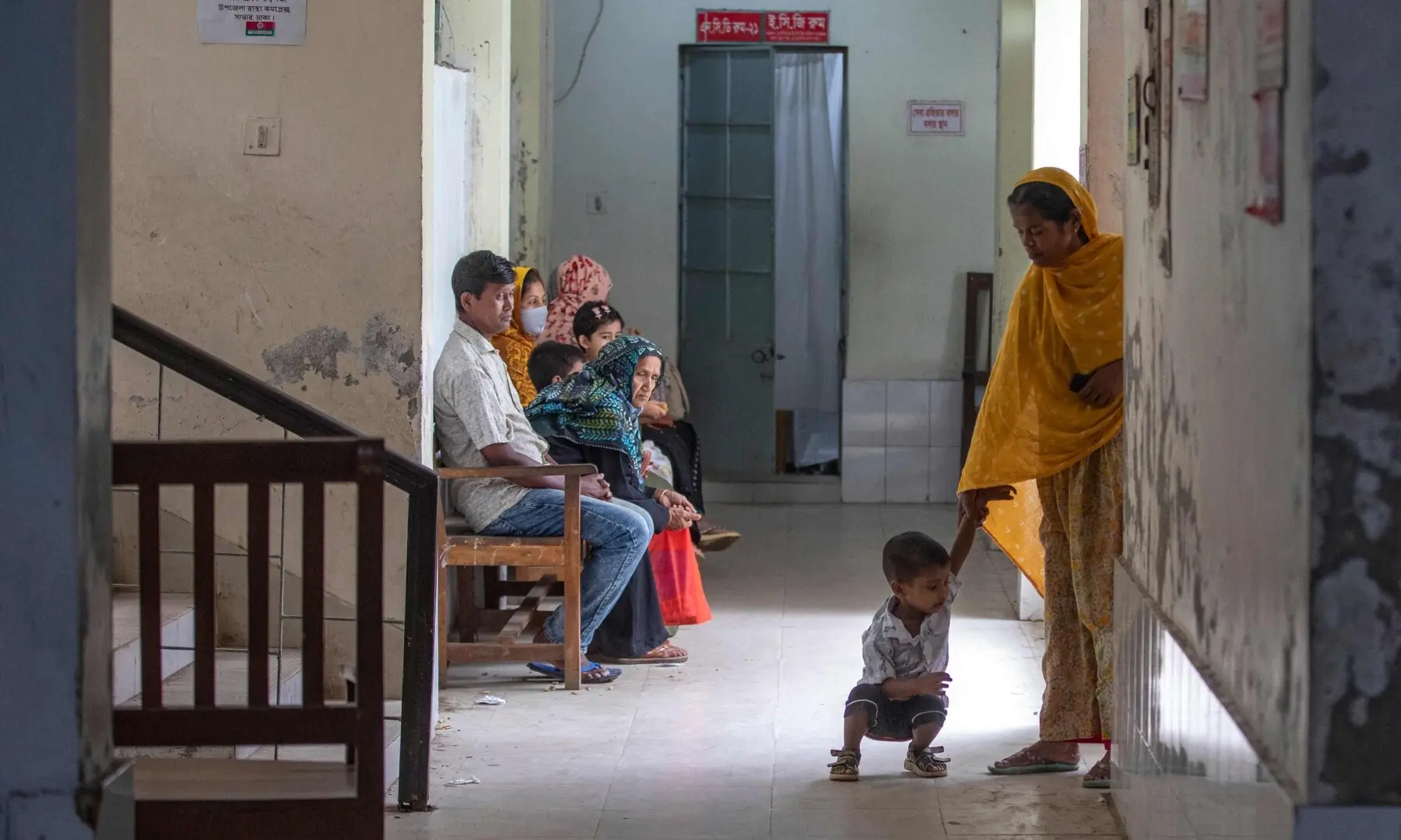 This photograph taken on April 27, 2026 shows people waiting in the lobby at the Savar Upazila Health Complex in Dhaka. &mdash;AFP
