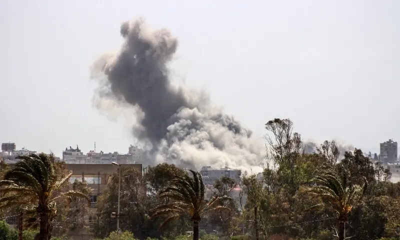 Smoke billows from the site of an Israeli airstrike that targeted the southern area of Burj al-Shamali, as seen from the city of Tyre on May 13. &mdash; AFP