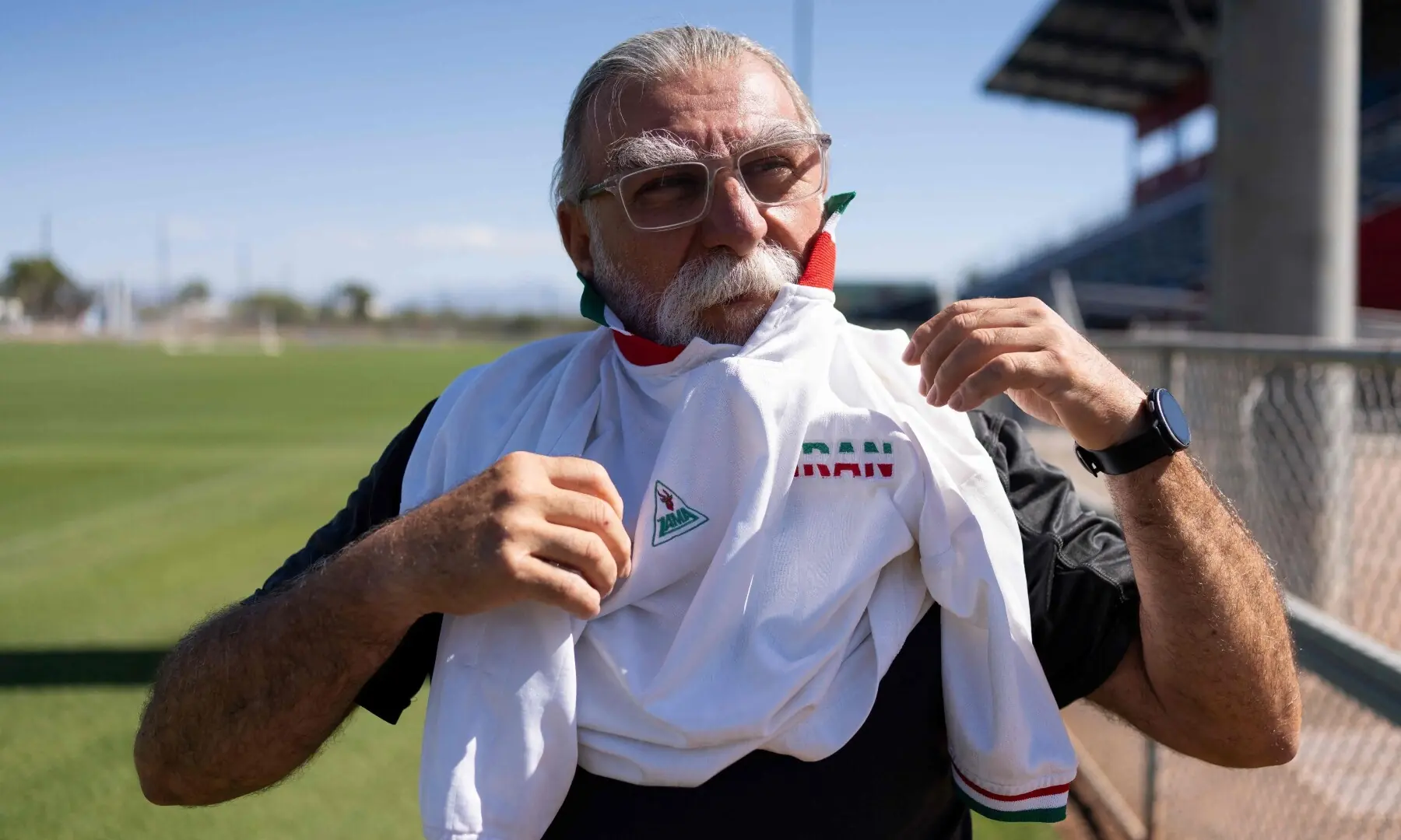 Amir Pajouyan, a member of the Iranian diaspora in Tucson, puts on an Iran jersey at the Kino Sports Complex, where Iran’s national football team will train during the 2026 FIFA World Cup, in Tucson, Arizona, the US on May 6, 2026. — AFP