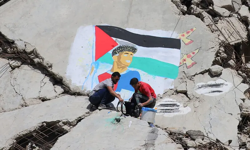 PALESTINIAN artists paint a mural of football star Lamine Yamal, who waved a Palestinian flag during FC Barcelona’s LaLiga victory parade, on the rubble of buildings destroyed by Israel at the Shati (Beach) refugee camp in Gaza City.—Reuters PALESTINIAN artists paint a mural of football star Lamine Yamal, who waved a Palestinian flag during FC Barcelona’s LaLiga victory parade, on the rubble of buildings destroyed by Israel at the Shati (Beach) refugee camp in Gaza City.—Reuters