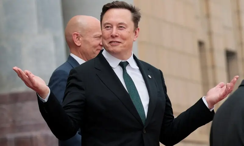 Elon Musk gestures as he leaves after attending a welcome ceremony for US President Donald Trump with Chinese President Xi Jinping at the Great Hall of the People in Beijing, China on May 14, 2026. &mdash; Reuters