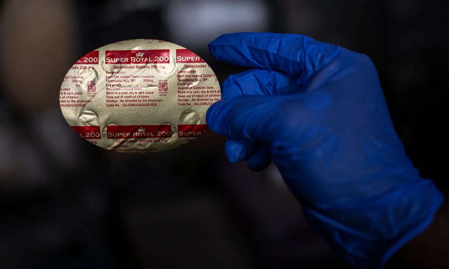 An officer holds a seized blister pack of “Super Royal 200” Tapentadol tablets at the National Drug Law Enforcement Agency (NDLEA) facility in Lagos, on February 19, 2026. — AFP