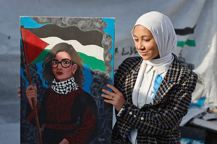 Fifteen-year-old displaced Palestinian Sarah Saada holds a portrait she painted of UN Special Rapporteur Francesca Albanese.—AFP/file Fifteen-year-old displaced Palestinian Sarah Saada holds a portrait she painted of UN Special Rapporteur Francesca Albanese.—AFP/file