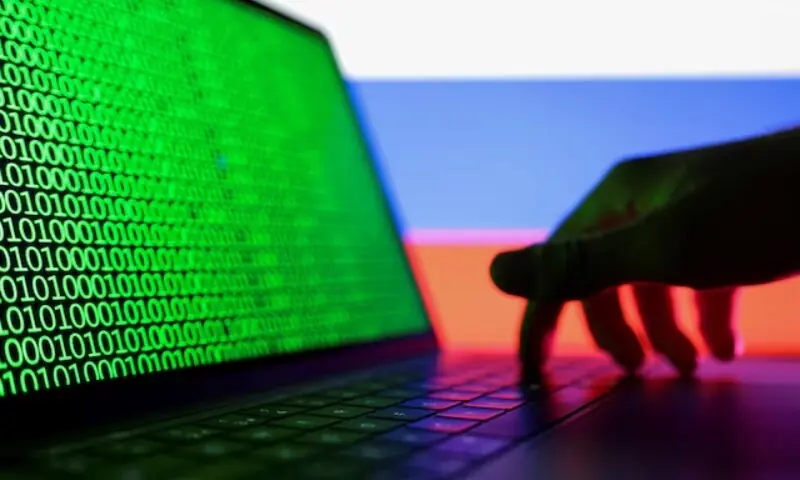 A hand is seen on a laptop with binary code displayed on the screen in front of Russian flag in this picture illustration taken August 19, 2022. —Reuters/file A hand is seen on a laptop with binary code displayed on the screen in front of Russian flag in this picture illustration taken August 19, 2022. —Reuters/file