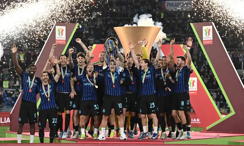 INTER Milan players celebrate with the Italian Cup trophy after defeating Lazio in the final at the Olympic Stadium.—AFP INTER Milan players celebrate with the Italian Cup trophy after defeating Lazio in the final at the Olympic Stadium.—AFP