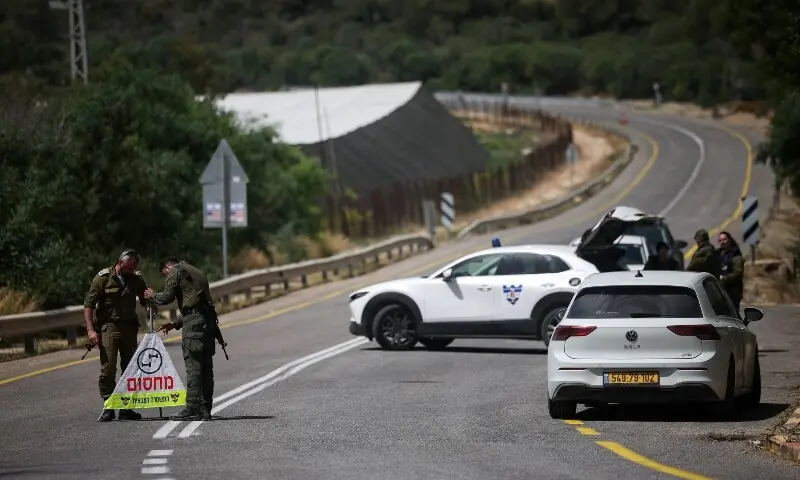 Soldiers set up a roadblock on the road leading to the tourist site of Rosh HaNikra in northern Israel, following a drone strike from Lebanon that injured three Israeli civilians according to the Israeli military, May 14, 2026. &mdash;Reuters