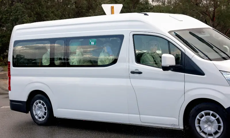 A bus carrying passengers caught up in the MV Hondius hantavirus outbreak, arrives at a purpose-built quarantine facility located on the outskirts of the Western Australian city of Perth on May 15, 2026. — AFP