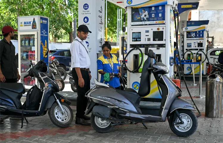 Scooters line up at a fuel station in Ahmedabad to fill tanks soon after India&rsquo;s state-run oil companies announced a hike in fuel prices amid disruptions to energy supplies due to the Iran war.&mdash;AFP