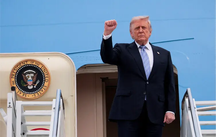 President Donald Trump gestures from the steps of Air Force One, before departing from Beijing.—Reuters President Donald Trump gestures from the steps of Air Force One, before departing from Beijing.—Reuters