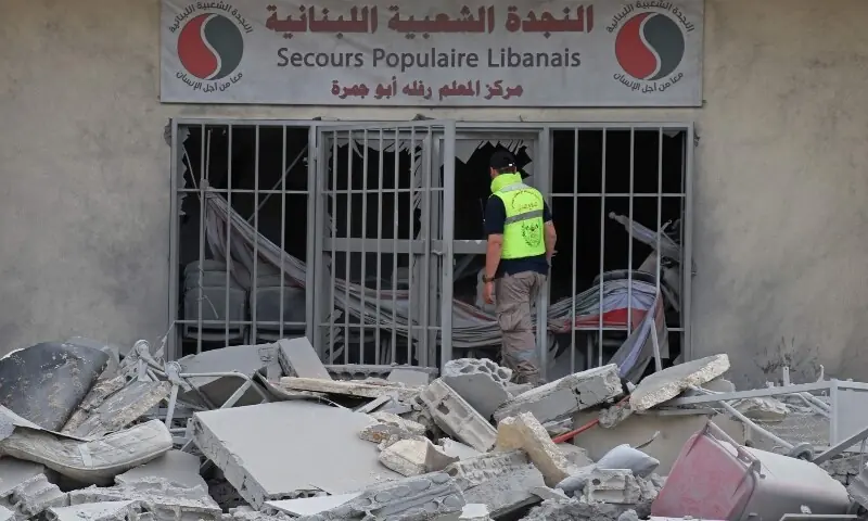 First responders clear the debris near the site of an Israeli airstrike that targeted the headquarters of a local NGO, in the southern coastal city of Tyre on May 15, 2026. &mdash;AFP